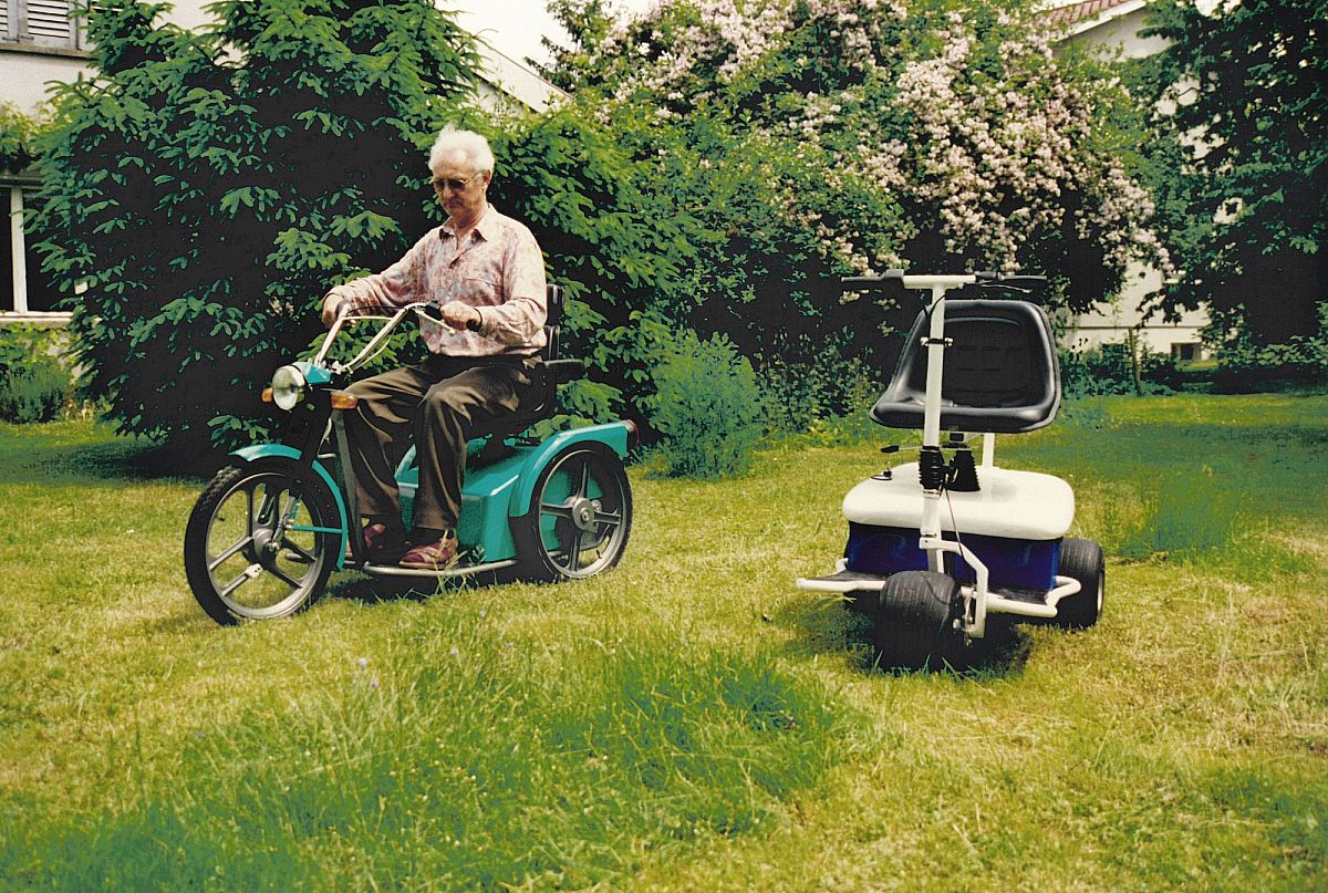 On the left, a green vehicle with a senior citizen can be seen on the lawn. To the right is a white Golfmobile.